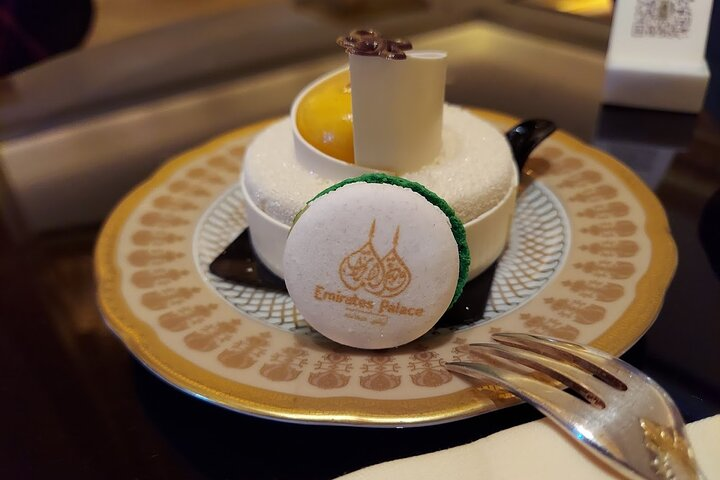 Indulge in exquisite treats at Emirates Palace where each bite showcases local ingredients perfectly complementing a serene visit to the stunning Sheikh Zayed Grand Mosque.